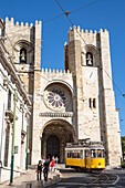 Electrico 28 tram passing in front of Se Catedral cathedral in Alfama district, Lisbon, Lisboa, Portugal