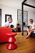 Couple sitting in a hotel suite, Barcelona, Catalonia, Spain