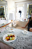 Two cups of coffee and a plate with fruits on a tabel in a hotel suite, Venice, Veneto, Italy