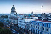 Cuba, Havana, Havana Vieja, the Capitolio Nacional and buildings by the Parque Central, elevated view, dusk