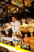 Barman at Bar Isabel preparing the Spritz l´Orange cocktail, Palermo Soho, Buenos Aires, Argentina