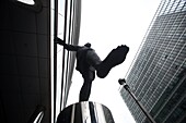 Statue of man walking on air outside the European Commission in Brussels, Belgium