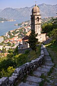 View from the medieval hill fortifications above Kotor across roof tops and Kotor Bay - Montenegro