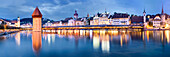 Panorama of the historic city of Lucerne overlooking the River Reuss with Jesuit Church, water tower, Chapel Bridge, St. Peter-Chapel, tower of the municipal hall and the musegg towers, Lake Lucerne, Lucerne, Switzerland