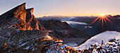 Morning at the summit of Uesseres Barrhorn with the first rays of the rising sun above the Swiss Alps, Valais, Switzerland