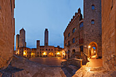 Towers and town hall on Piazza del Duomo square at night, San Gimignano, hill town, UNESCO World Heritage Site, province of Siena, Tuscany, Italy, Europe