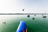 Blop jump into Lake Starnberg, Bavaria, Germany