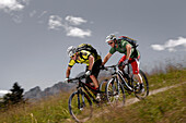 Two mountain bikers off roading, Eckbauer, Garmisch-Partenkirchen, Bavaria, Germany