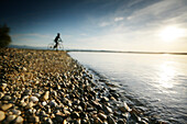 Man cyclocross touring in autumn, Lake Starnberg, Ambach, Munsing, Bavaria, Germany