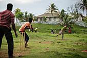 Cricket players at army ground, historic district, Galle, Southern Province, Sri Lanka