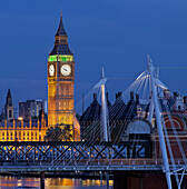 Westminster Palace and Big Ben with Hungerford Bridge at night, Charing Cross, London, England