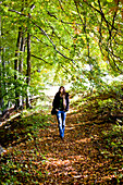 Young woman in an autumn forest, Styria, Austria