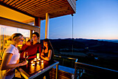 Young people drinking white wine on a terrace, Gamlitz, Styria, Austria