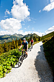 Mountain bikers on a gravel road, Duisitzkar, Planai, Styria, Austria