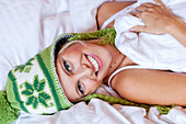 Young woman wearing a woolly hat looking at camera, Styria, Austria