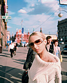 RUSSIA, Moscow, young woman wearing sunglasses on Tverskaya Ulitsa.