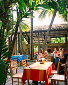 SRI LANKA, Asia, Colombo, friends sitting in Barefoot Cafe in Colombo.