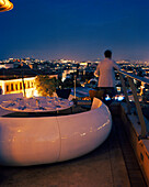 TURKEY, Istanbul, rear view of man standing on roof of 360 Restaurant