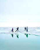 USA, Alaska, kids playing on an ice floe, Point Barrow