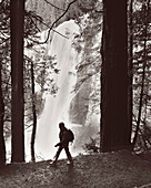 USA, California, Yosemite National Park, a woman hikes the trail down from Vernal Falls (B&W)