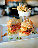 USA, California, Los Angeles, Beverly Hills, food shot of a hamburger and fries at The BLVD Restaurant, Beverly Wilshire Hotel, Four Seasons Resort on Rodeo Drive