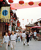 CHINA, Hangzhou, people walking on Hefang Lu street
