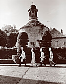 France, Burgundy, chefs walking in garden, Abbaye De La Bussiere Restaurant and Hotel, Dijon (B&W)
