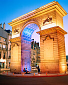 FRANCE, Burgundy, exterior of illuminated arch at night, Dijon
