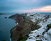 GREECE, Santorini, Oia, homes, restaurants and villas cover the top of the cliffs of Oia, the Mediterranean Sea