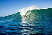 USA, Hawaii, man surfs a large wave on an outer reef, the North Shore of Oahu