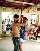 HONDURAS, Roatan, people watching a young couple dancing the Samba, Punta Gorda