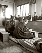 INDIA, West Bengal, monks and students at monastery, Samten Choling Monastery, Ghoom (B&W)