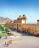 INDIA, Jaipur, people and birds circling at the Amber palace