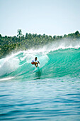 INDONESIA, Mentawai Islands, Kandui Resort, surfer on a wave called E-Bay