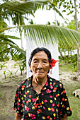 INDONESIA, Mentawai Islands, Kandui Resort, portrait of a Mentawai elder with tattos named Tatiana