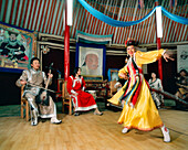 MONGOLIA, Ulaanbaatar, woman performing traditional Mongolia dance with the band Altain Orgil at the Abtai, Sain Khan Palace