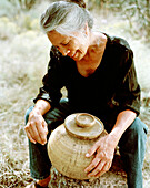 USA, New Mexico, beautiful Native American artist with her pot, Valley of the Wild Roses