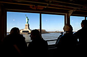 USA, New York, tourists taking a boat tour to visit the Statue of Liberty National Monument and Ellis Island