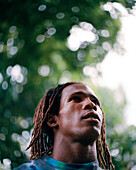 PANAMA, Bocas del Toro, portrait of a young man in the jungle, Central America