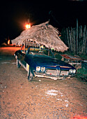 PANAMA, Bocas del Toro, a car with a thatched palapa roof