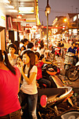 VIETNAM, Hanoi, people gather in large numbers to eat ice cream on a hot Summer night in downtown Hanoi