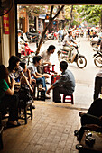 VIETNAM, Hanoi, friends socialize and drink coffee at a local coffee shop, Cafe Nang in the Old quarter