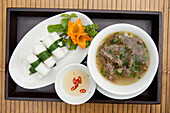 VIETNAM, Hue, goi cuon (fresh summer roll) and pho bo (beef noodle dish)