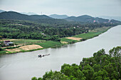 VIETNAM, Hue, an elevated view of the Perfume River, farmland, and a longtail boat