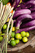 VIETNAM, Hue, an assortment of limes, eggplants and onions at a rural roadside market