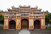 VIETNAM, Hue, an ornate painted entry gate at the Citadel in Hue
