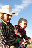 USA, Wyoming, Encampment, a woman and her son are dressed in cowboy attire, Abara Ranch