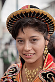 Portrait of young peruvian girl with tradtional dresses during a procession in Cusco, Cuzco, Peru, Andes, South America