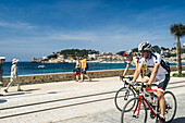 Cyclists on the promenade, Port de Soller, Soller, Majorca, Spain