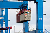 Container ship loading and unloading at the container terminal Burchardkai, Hamburg, Germany